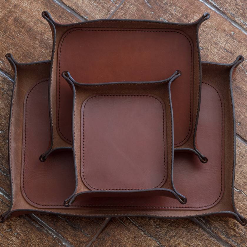 Set of three small, medium, and large non-engraved Italian leather valet trays in brown whiskey color.