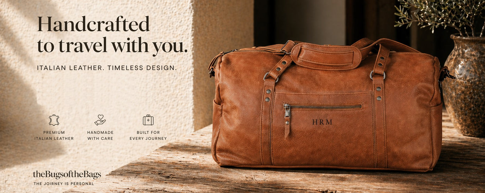 Brown leather duffel bag on a wooden surface with a neutral background