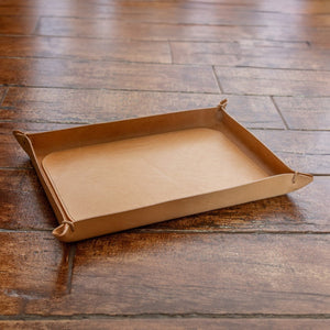 Brown paper tray on a wooden surface