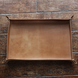 Large tray with leather cords at the corners, in natural Italian full-grain leather, non-engraved.