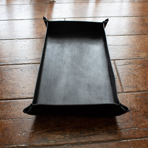 Black, oblong tray crafted by hand from Italian full-grain leather, not engraved.