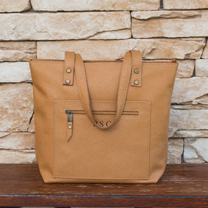 Tote bag made of high-quality Italian leather with a zip pocket and an optional top zip closure.