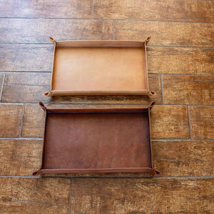 Brown leather tray on a floor